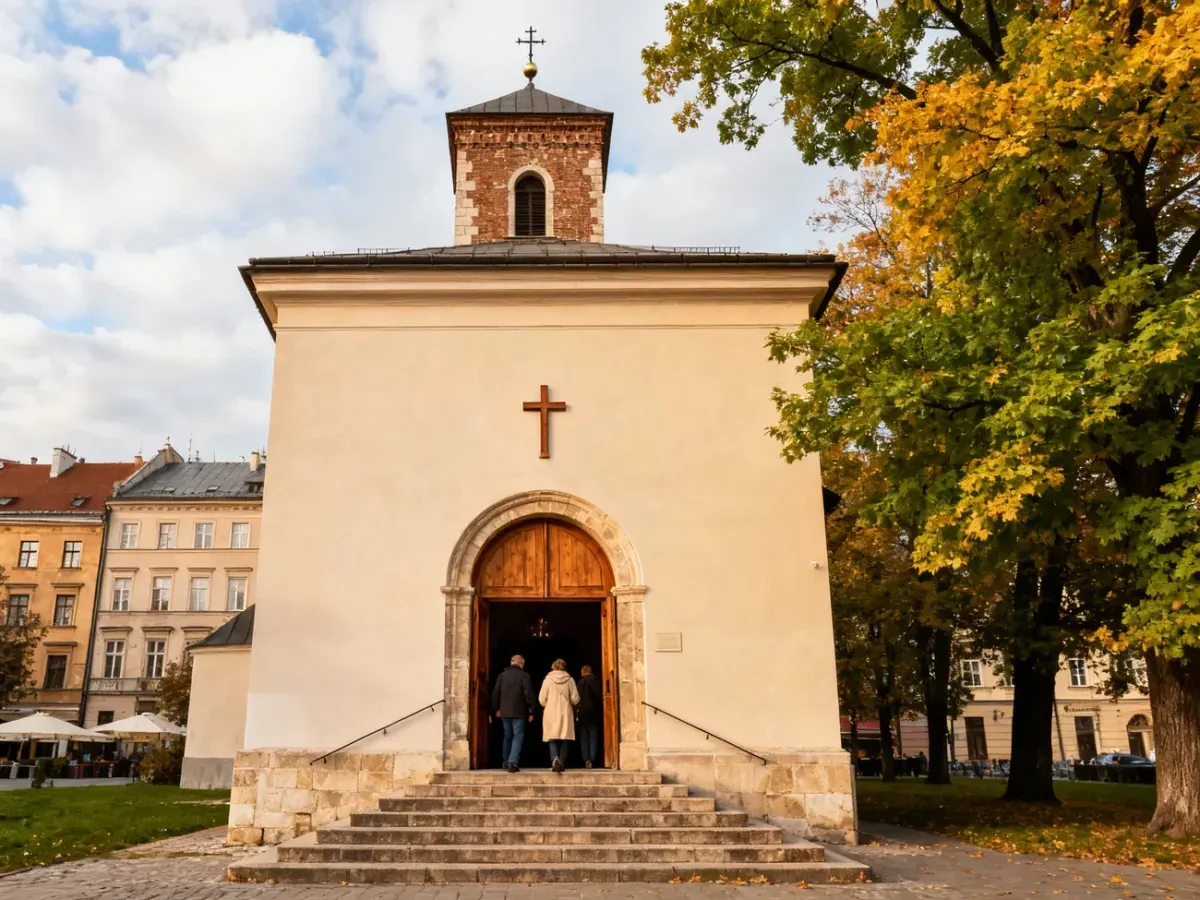Wejście do zabytkowego kościoła w Krakowie, wierni wchodzą na mszę, spokojna, jesienna atmosfera sakralna.